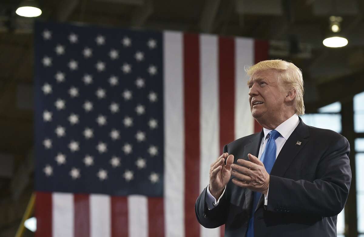 Republican presidential nominee Donald Trump arrives for a rally at the J.S. Dorton Arena in Raleigh, North Carolina on November 7, 2016. Hillary Clinton and Donald Trump battled for votes on a frenzied final day of campaigning Monday, telling Americans the country's fate rides on who they choose as the next US president. / AFP PHOTO / MANDEL NGANMANDEL NGAN/AFP/Getty Images