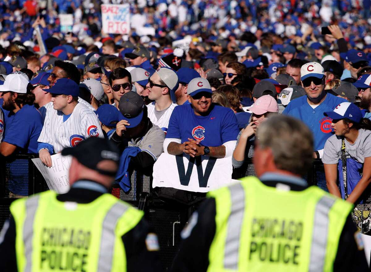 Chicago Cubs fans celebrate before a rally in Grant Park honoring the World Series baseball champions in Chicago, Friday, Nov. 4, 2016. (AP Photo/Nam Y. Huh)