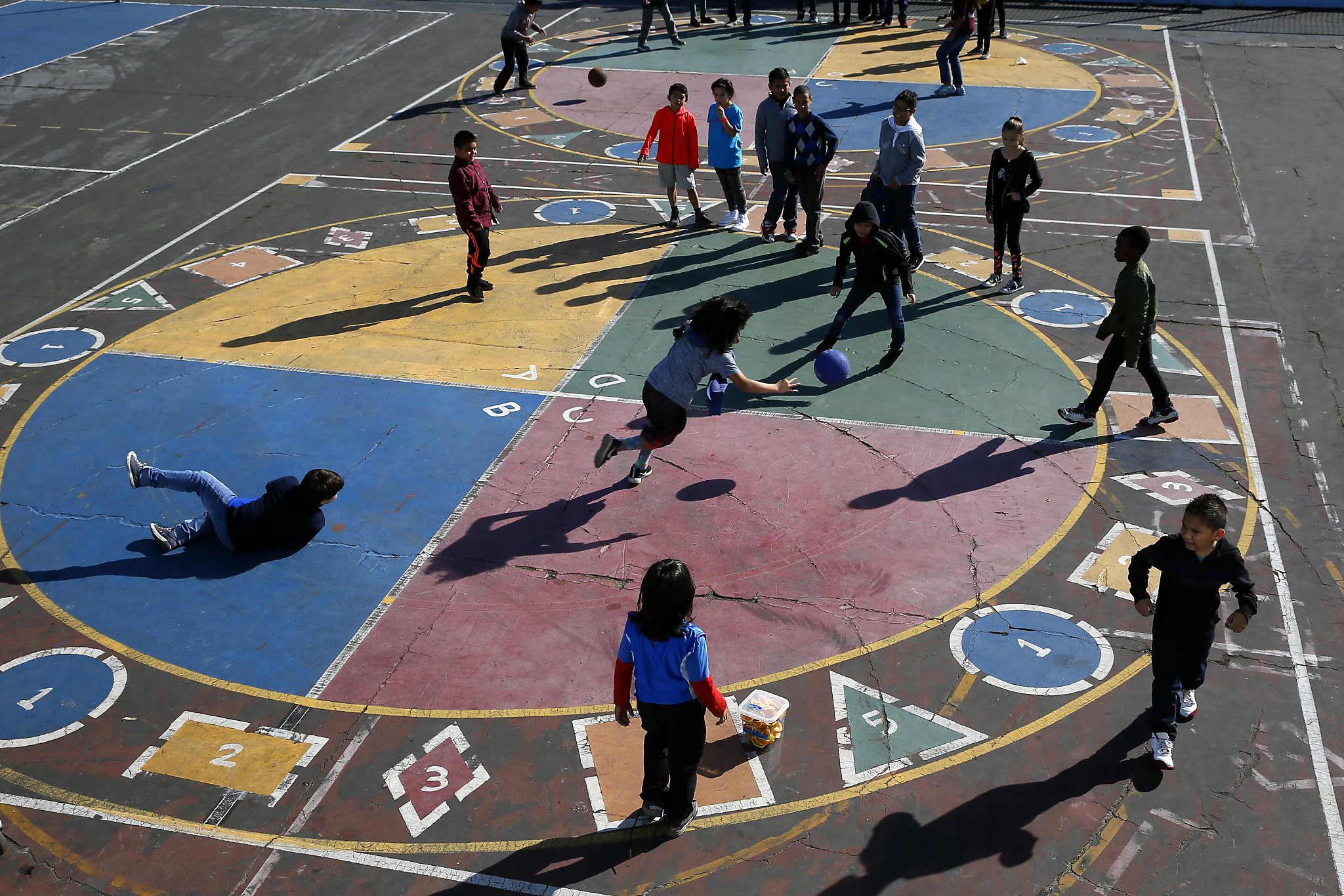 Students enjoys recess time and a game of four square at Glen Park  Elementary School in San Francisco, California, on Thursday November 3,  2016 (Michael Macor/San Francisco Chronicle via AP Stock Photo 
