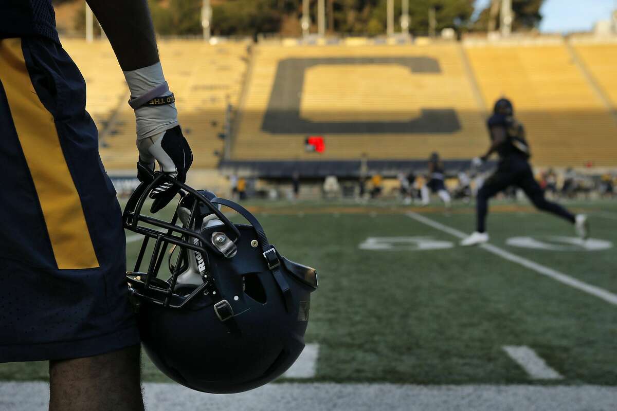 A player watches from the sidelines as the team goes through drills during football practice at Memorial Stadium in Berkeley, Calif., on Wednesday, November 5, 2014. Cal is making it much harder for student-athletes to be admitted to the University. Practice is at Memorial Stadium.