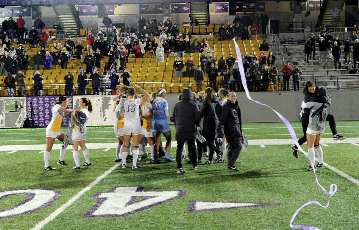 UAlbany players celebrate a 2-1 win against Hartford during an NCAA women's college soccer final in the America East Conference on Sunday, Nov. 6, 2016, in Albany, N.Y. (Hans Pennink / Special to the Times Union) ORG XMIT: HP114