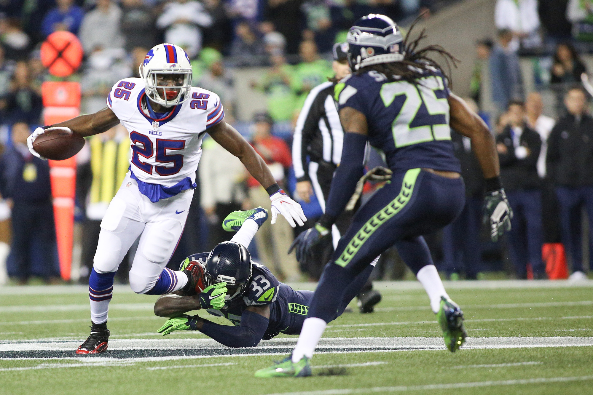 Seattle Seahawks strong safety Kam Chancellor (31)(R) celebrates his  interception with free safety Earl Thomas (29) with cornerback Richard  Sherman (25) and outside linebacker K.J. Wright (50) near by during the  first