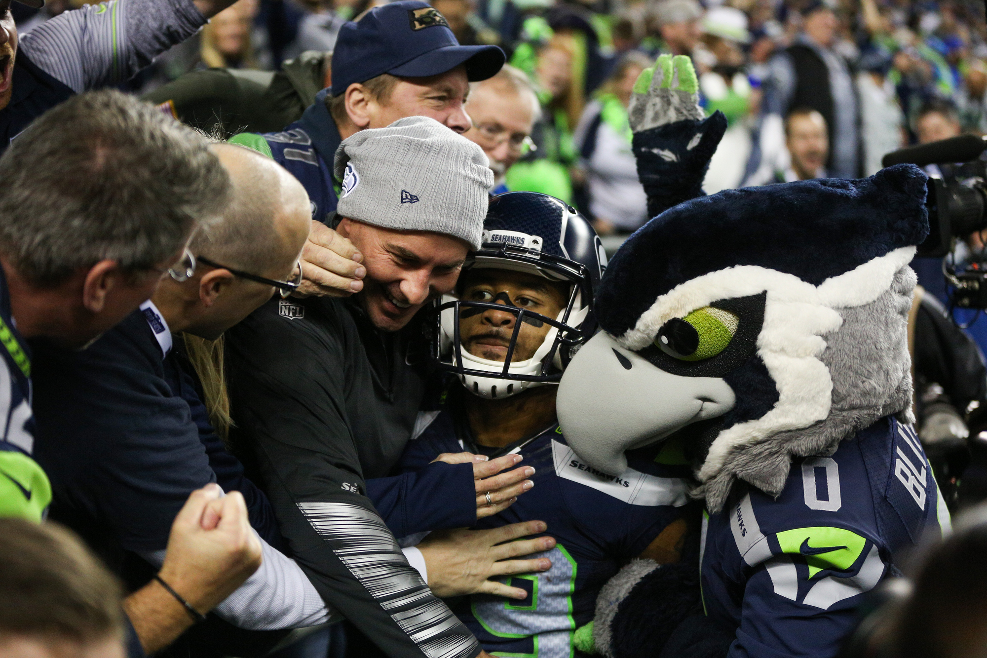 Seattle Seahawks strong safety Kam Chancellor (31)(R) celebrates his  interception with free safety Earl Thomas (29) with cornerback Richard  Sherman (25) and outside linebacker K.J. Wright (50) near by during the  first