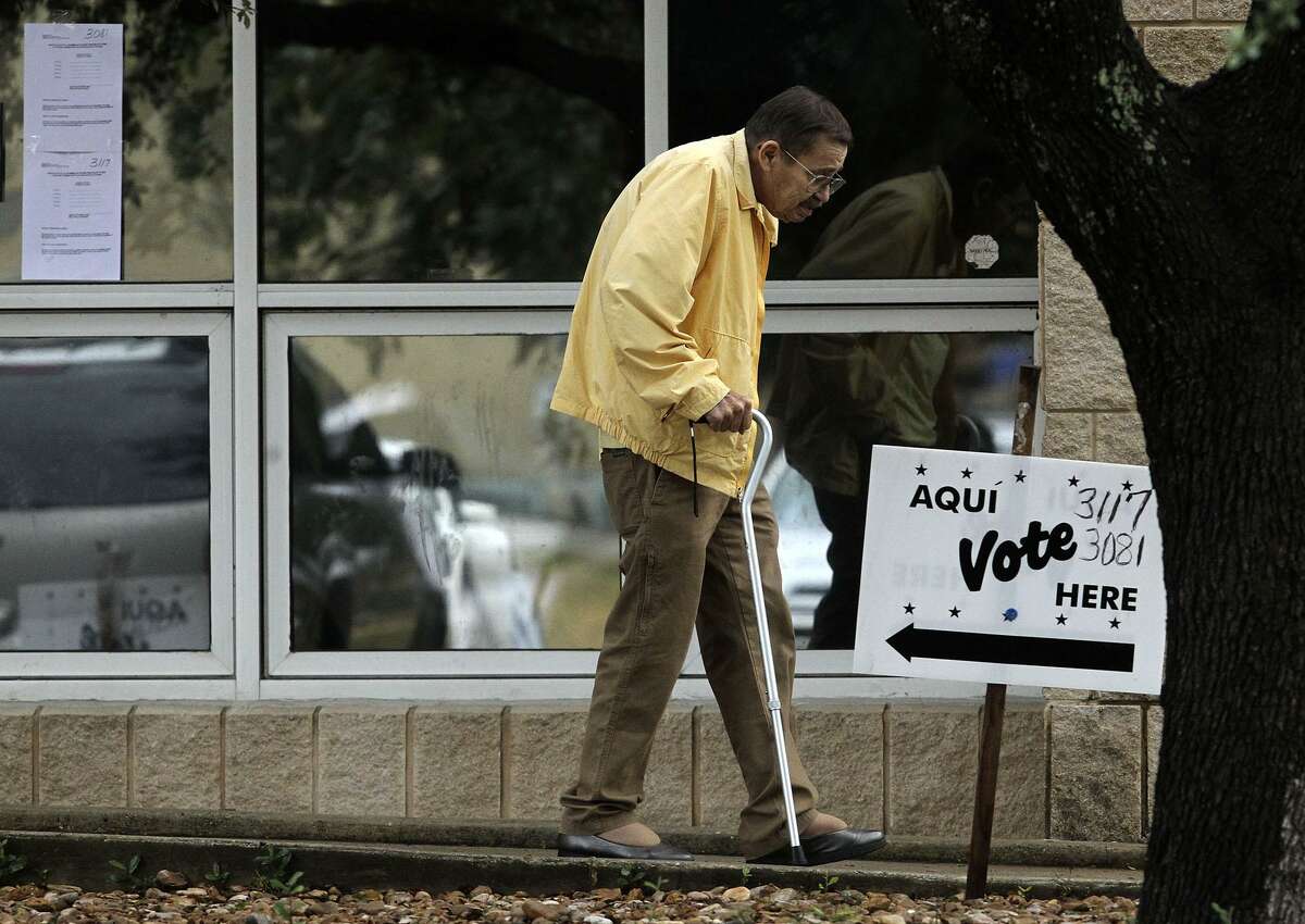 Voters were sparse at the Brook Hollow Branch of the San Antonio Public Library early on Election Day compared to the previous early voting days. There were no lines and one man said he only had two other voters ahead of him once he entered the building.