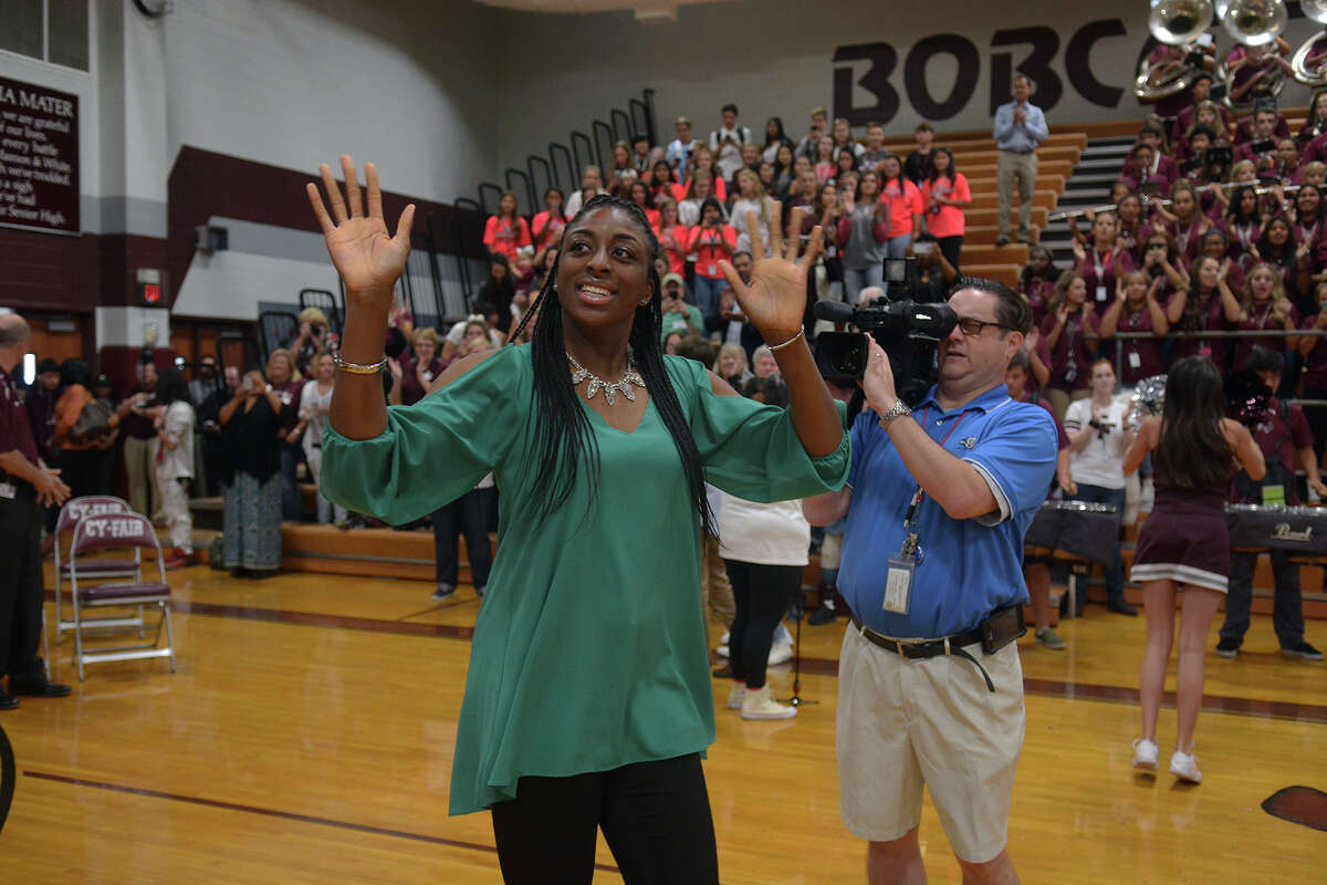 Nneka Ogwumike acknowledges waves as she enters the Cy-Fair High School gym for the pep rally held in her honor on Friday, Oct. 28, 2016. (Photo by Jerry Baker/Freelance)
