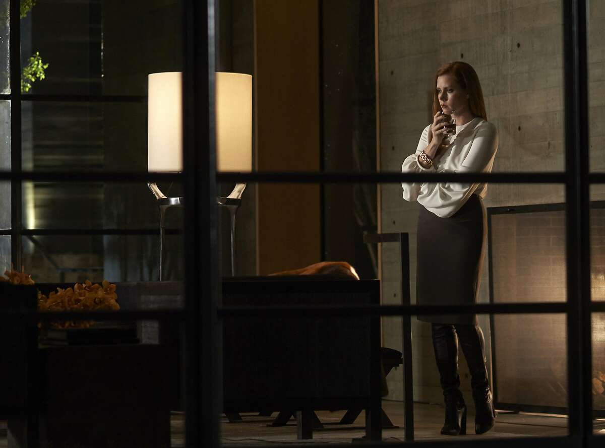 This image released by Focus features shows Amy Adams in a scene from the romantic thriller, "Nocturnal Animals." Adams stars in two complex performances this fall, in Denis Villeneuve's sci-fi "Arrival," opening Nov. 11, and Tom Ford's "Nocturnal Animals," opening Dec. 9. (Merrick Morton/Focus Features via AP)