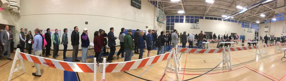 Residents wait in line to vote at Darien Town Hall on Tuesday, Nov. 8, 2016. 