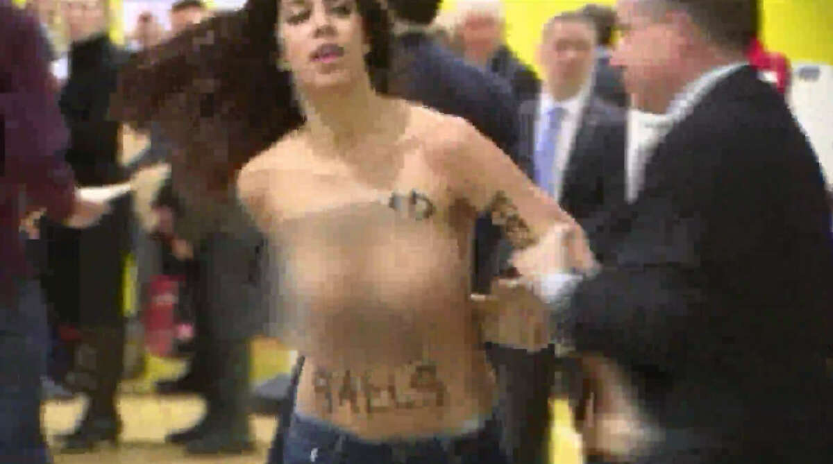 Topless women protest at Donald Trumps