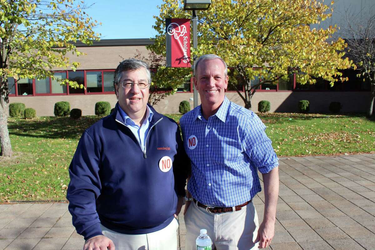 First Selectman Rob Mallozzi, left, and Selectman Nick Williams spent most of Election Day, Nov. 8, 2016 outside New Canaan High School educating voters about the proposed changes to the Town Charter.