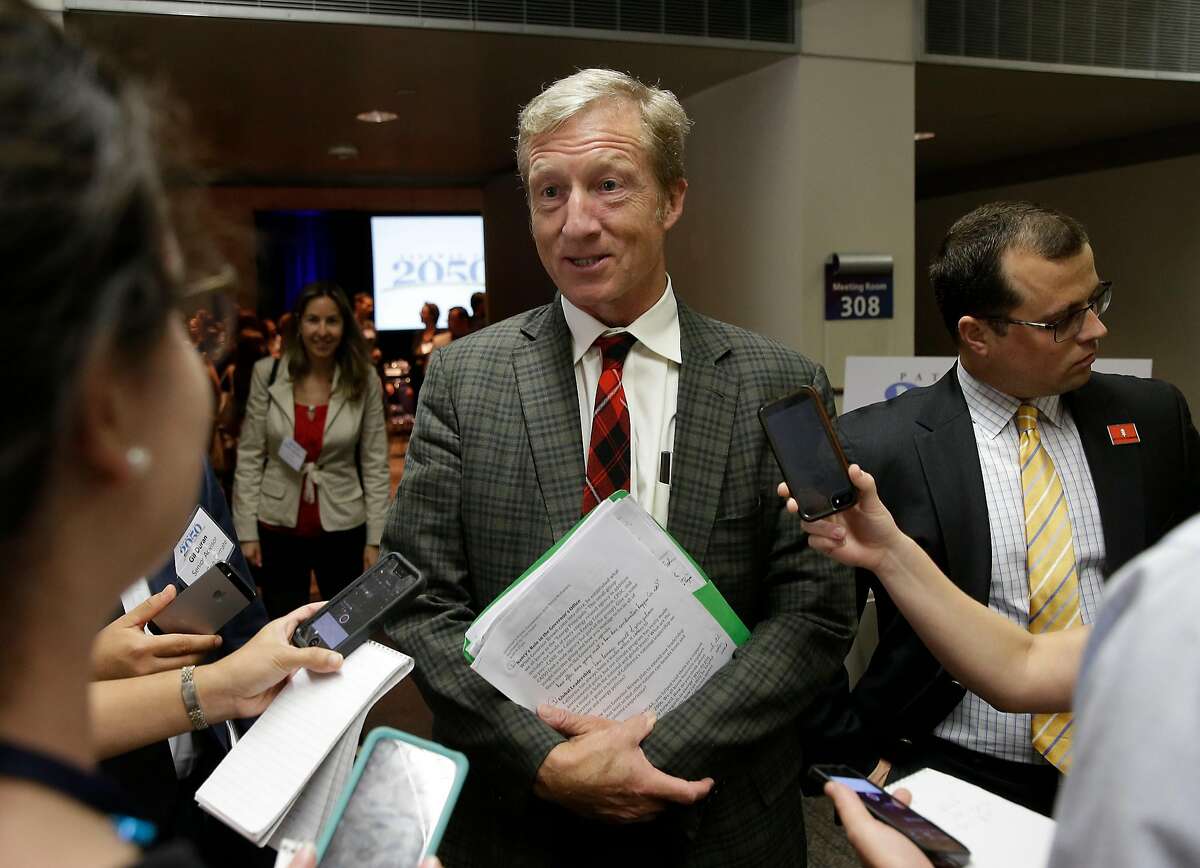 In this photo taken Thursday, Aug. 20, 2015, billionaire Tom Steyer talks with reporters in Sacramento, Calif. Steyer, on Wednesday, announced joining an effort to raise California's cigarette tax by $2 per pack through a ballot initiative. (AP Photo/Rich Pedroncelli)