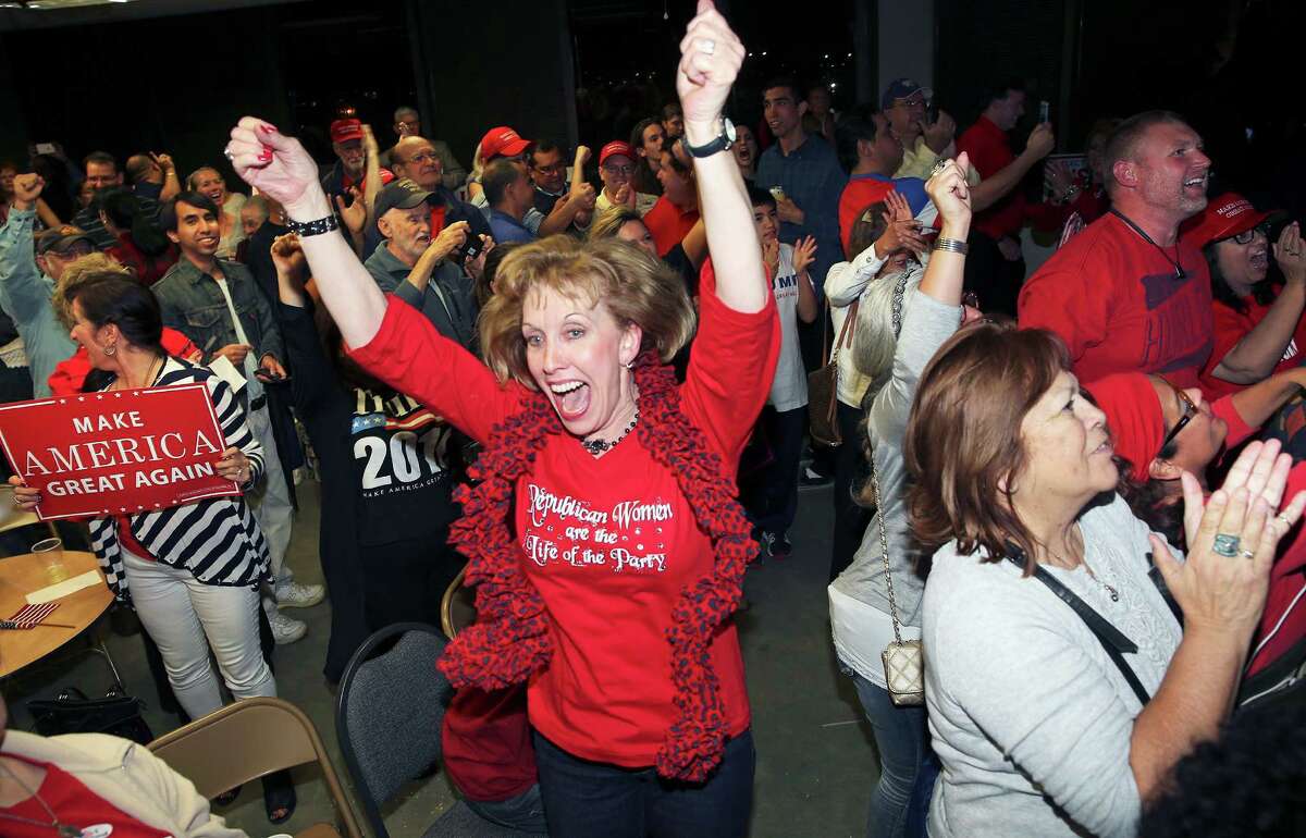 Cynthia Smith, legal counsel for Republicans, goes in to a happy dance over results from Florida as Republicans hold their election night watch party at their headquarters at 909 NE Loop 410 on November 8, 2016.