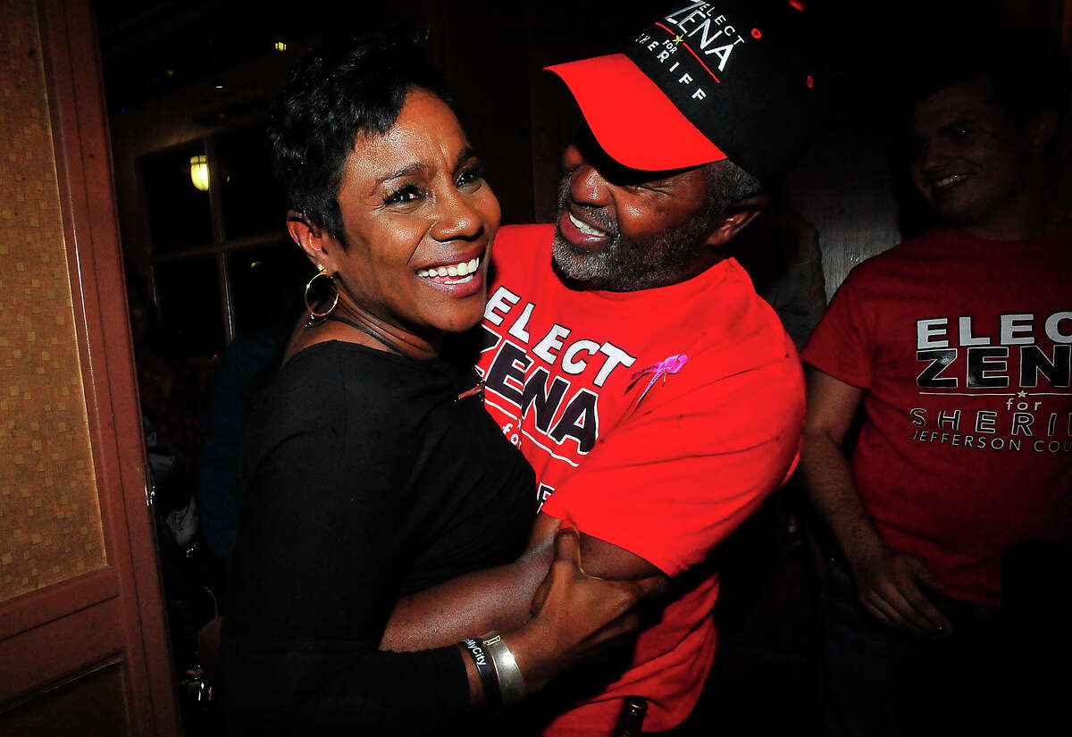Zena Stephens, Democratic candidate for Jefferson County Sheriff, is swarmed by supporters offering hugs of congratulations and celebrating her win over Republican Ray Beck as she and supporters gather for an election result party at Suga's in Beaumont Tuesday. Photo taken Tuesday, November 8, 2016 Kim Brent/The Enterprise
