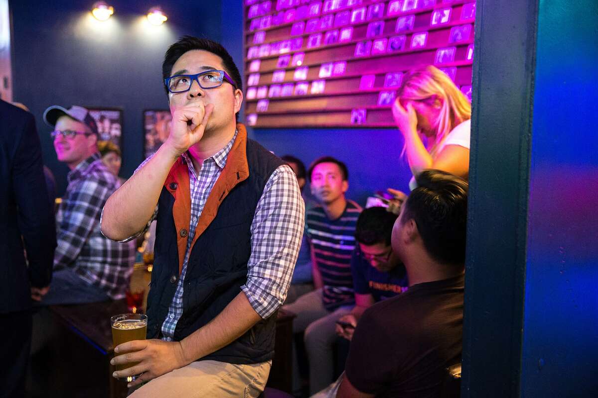 Lawrence Mak, a supporter, checks the elections, during Scott Wiener's election night party at Beaux, on Tuesday, Nov. 8, 20166 in San Francisco, Calif. Wiener is a state Senate candidate.