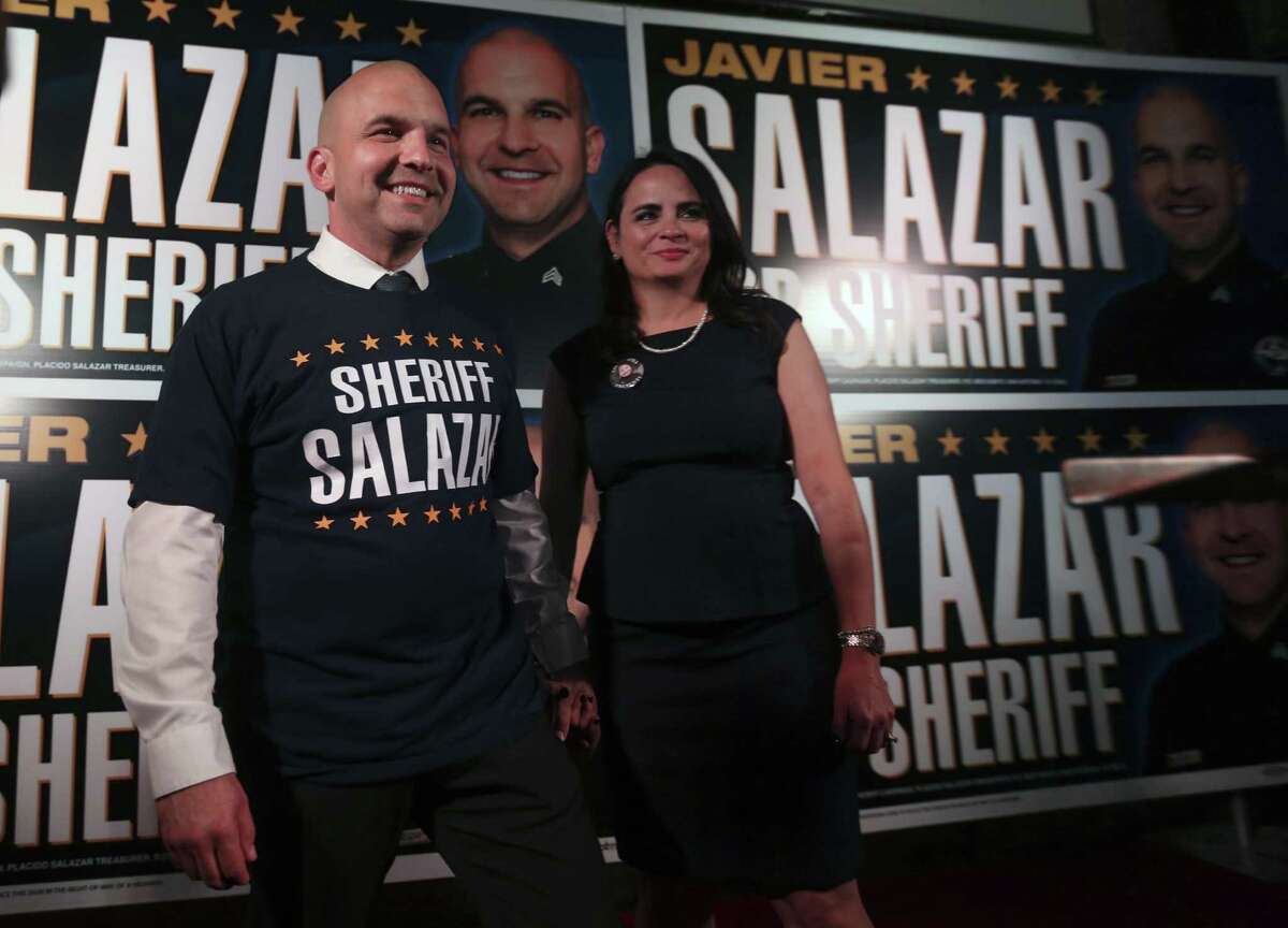 Bexar County Sheriff-elect Javier Salazar, flanked by his wife Sarah, smiles Tuesday, Nov. 8, 2016 at the Cadillac Bar after he declared victory over incumbent Susan Parmerleau.