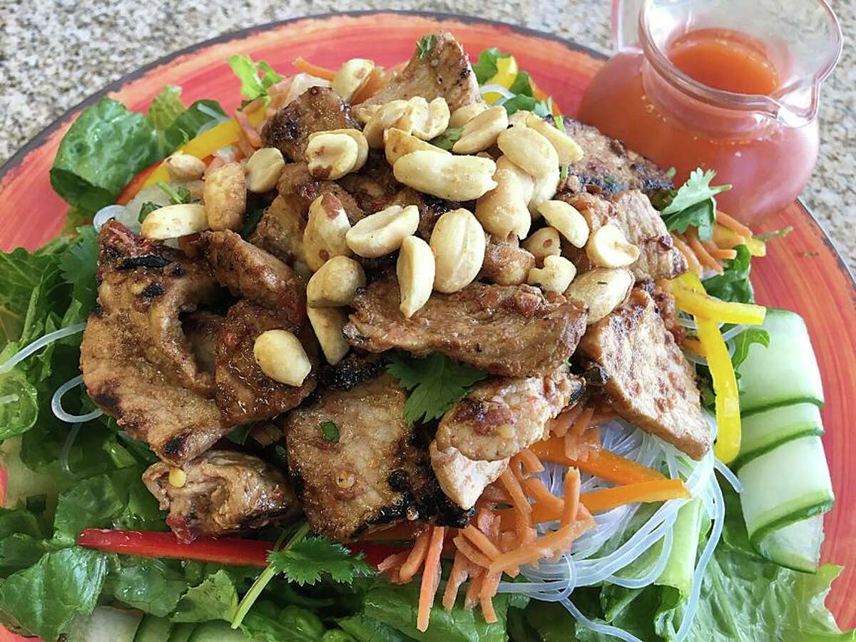 A Vietnamese salad includes roasted pork, cucumber, carrot, daikon radish, mint, Romaine, peanuts and nuoc cham dressing at Thyme for Lunch.