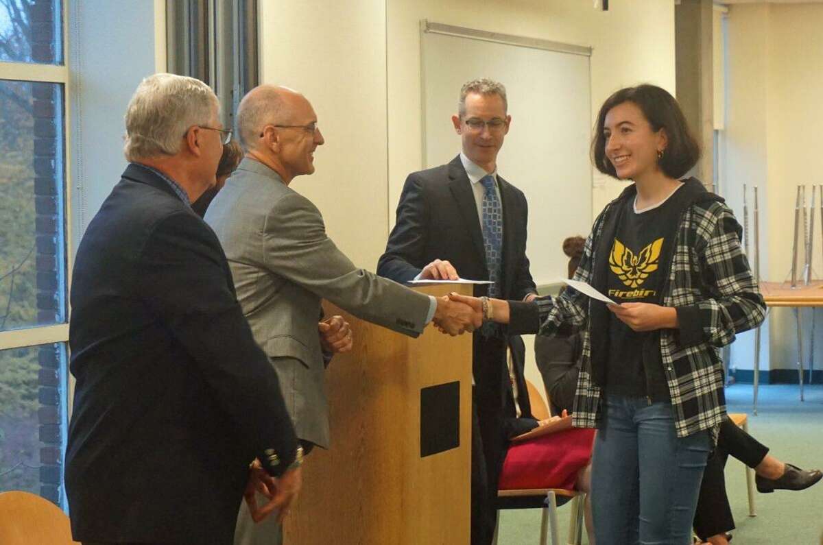 GHS senior Lucie Turkel (far right) was recognized by (from L to R) Superintendent of School Sal Corda, GHS Headmaster Chris Winters and Cantor House Administrator Jason Goldstein as a National Merit Commended Scholar in a ceremony Wednesday