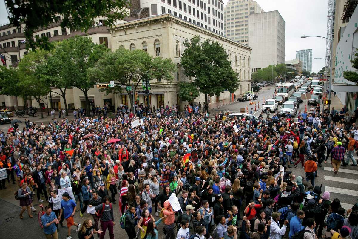 Anti-Trump protesters march along Congress Avenue in Austin, Texas, on Wednesday Nov. 9, 2016. Hundreds of University of Texas students march through downtown Austin in protest of Donald Trump's presidential victory. ( Jay Janner/Austin American-Statesman via AP)