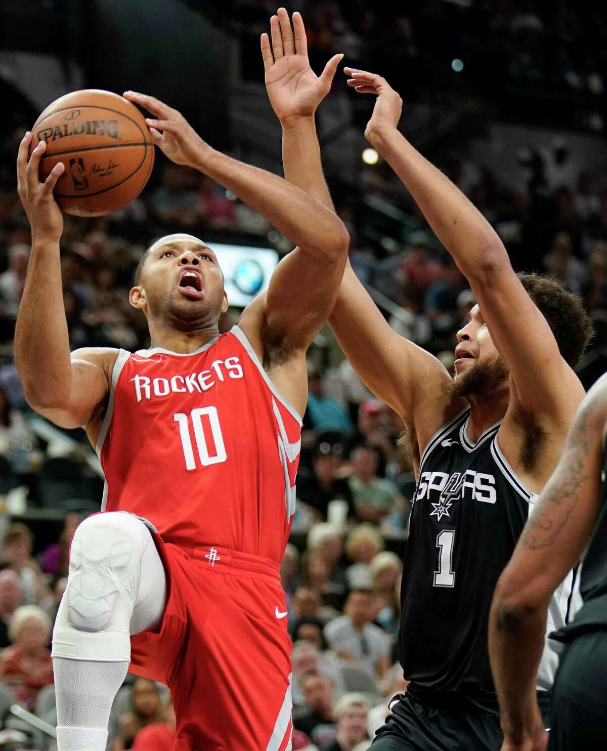 Houston Rockets' Eric Gordon (10) shoots against San Antonio Spurs' Kyle Anderson during the first half of an NBA basketball game, Sunday, April 1, 2018, in San Antonio. (AP Photo/Darren Abate)