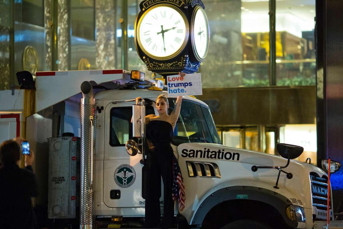 Musician Lady Gaga stages a protest against Republican presidential nominee Donald Trump on a sanitation truck outside Trump Tower in New York City after midnight on election day November 9, 2016. Donald Trump stunned America and the world, riding a wave of populist resentment to defeat Hillary Clinton in the race to become the 45th president of the United States. The Republican mogul defeated his Democratic rival, plunging global markets into turmoil and casting the long-standing global political order, which hinges on Washington's leadership, into doubt.