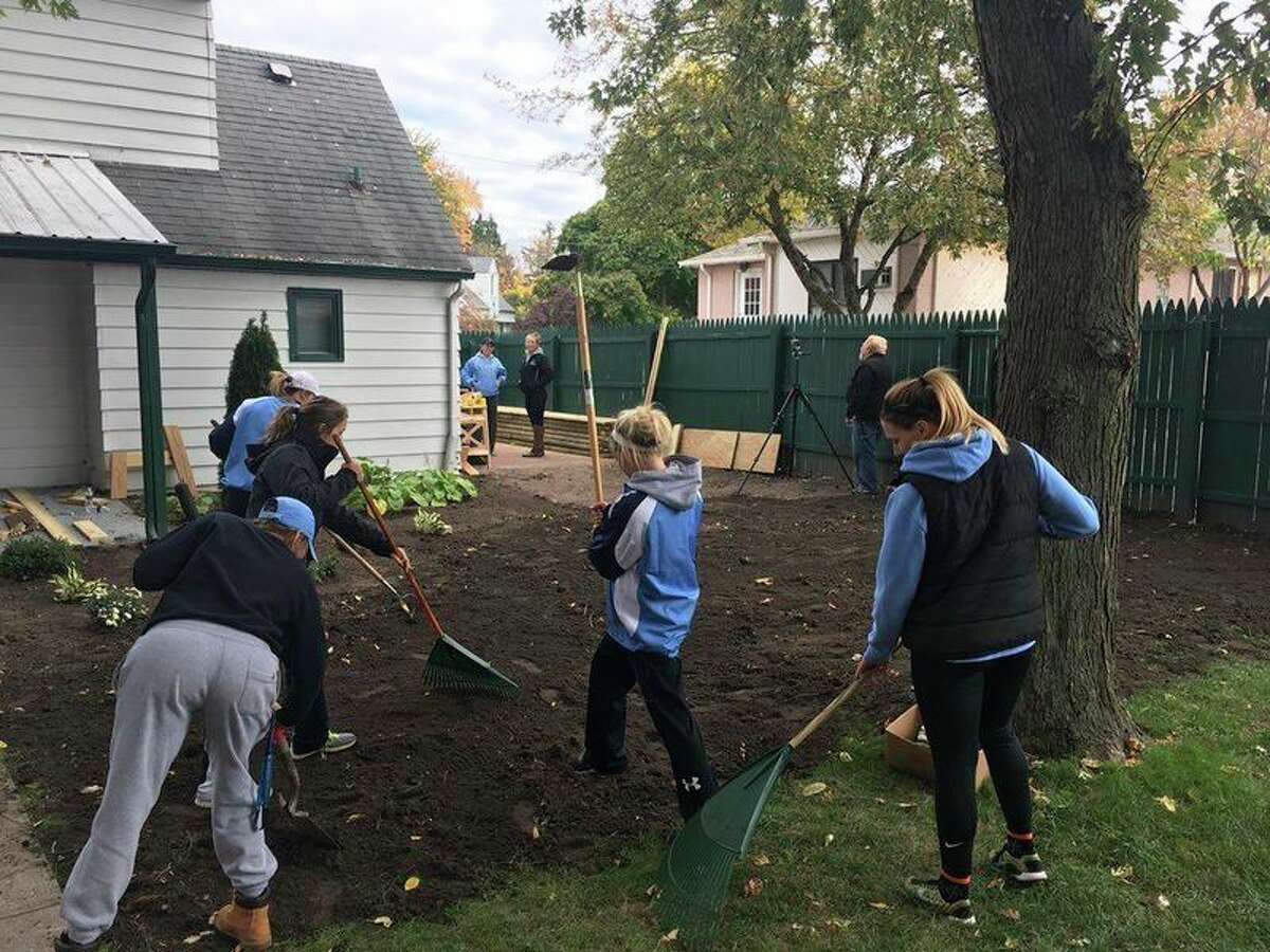 Northwood students work on raking a yard in this photo provided to the Daily News.