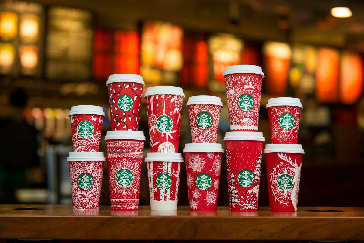 Starbucks began rolling out their infamous red holidays cups in stores nationwide today. The cups feature designs that were drawn by customers. Scroll through the slideshow to see all 13.