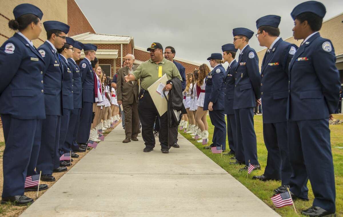 Veterans and guests are honored Thursday 11-10-16 in a tribute path following the MISD Veterans Day Program at Bowie Fine Arts Academy with U.S. Ovation, a musical and comedy variety show along the lines of USO performances during past wars. Tim Fischer/Reporter-Telegram