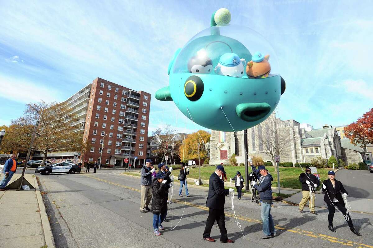 Volunteers practice walking with a new balloon featuring the Octonauts following a press conference about the upcoming UBS Parade Spectacular on Forest St. in downtown Stamford, Conn. on Thursday, Nov. 10, 2016.