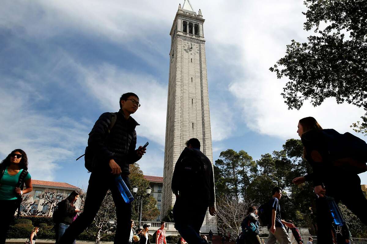 Students pass in front of the Campanile Tower on the Cal campus in Berkeley, CA Wednesday, February 11, 2016.