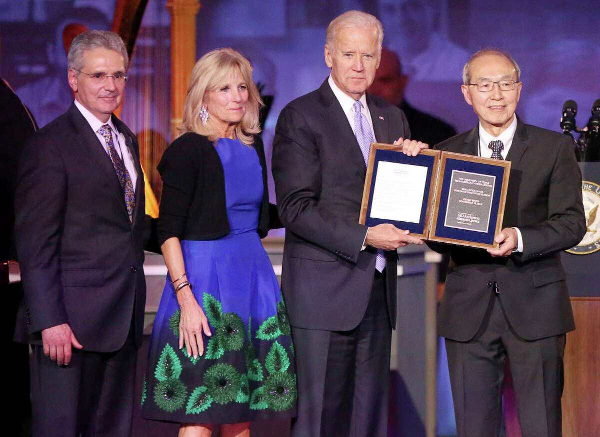 United States Vice President Joe Biden and his wife, Dr. Jill Biden, receive a special plaque commemorating the new Beau Biden Chair for Brain Cancer Research from Dr. Alfred Yung and University of Texas MD Anderson Cancer Center President Dr. Ronald DePinho at the institution's 75th Anniversary Gala on Thursday, November 10, in Houston. Biden's son, Beau Biden, was admitted and treated at MD Anderson for brain cancer in 2013.
