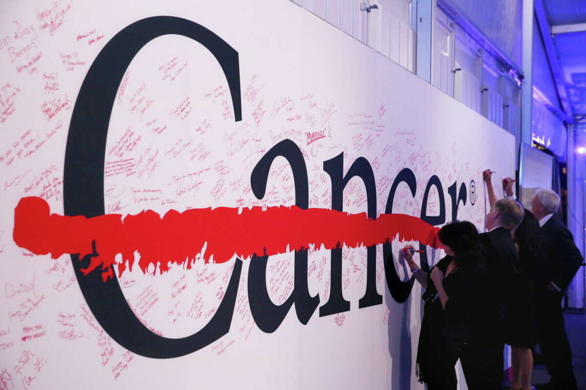Guests are invited to write their thoughts on a board at the 75th Anniversary Gala of University of Texas MD Anderson Cancer Center Thursday, Nov. 10, 2016, in Houston.