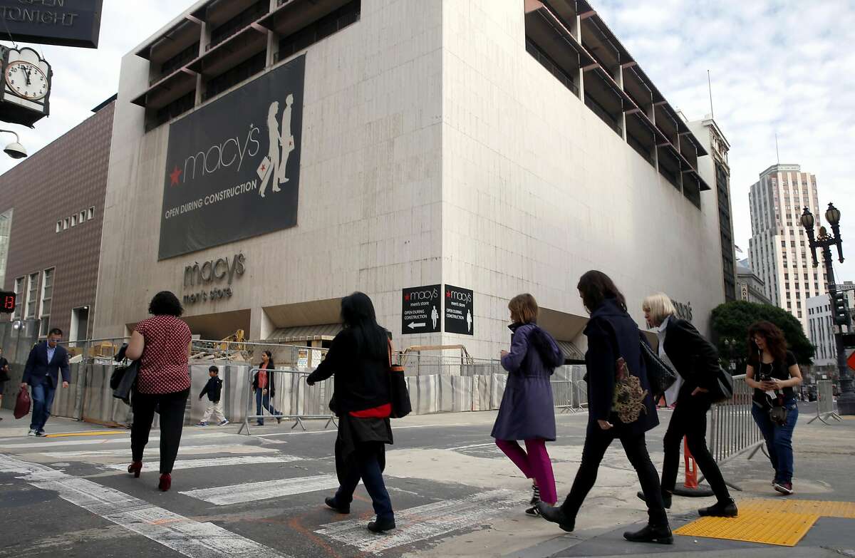 Pedestrians cross O'Farrell Street in front of the Macy's men's store at Stockton Streeet in San Francisco, Calif. on Friday, Nov. 11, 2016. The building was recently sold raising concerns by some that a high-rise tower will be built on the site.