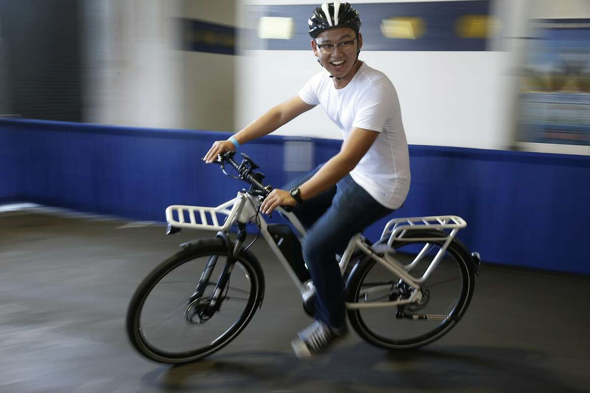 Phillip Tran test-rides a Blix electric bicycle at the Green Festival Expo in San Francisco on Saturday, Nov. 12, 2016.