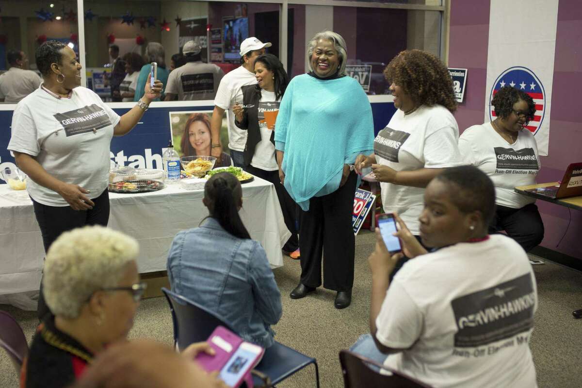 Barbara Gervin-Hawkins, center, celebrates a large lead in voting returns with supporters during an election night event, Tuesday, Nov. 8, 2016, at her campaign headquarters in San Antonio. (Darren Abate/For the Express-News)