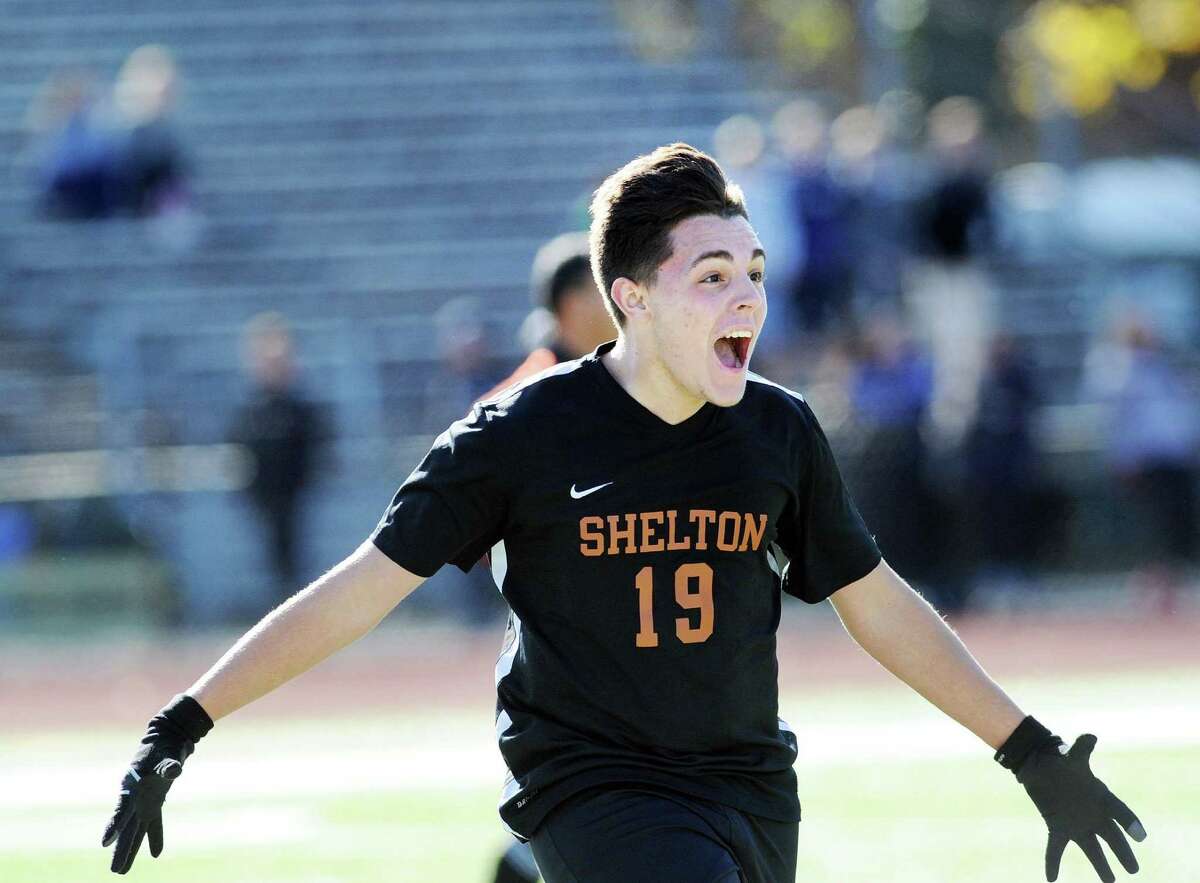Shelton's Tyler Carvalho (19) reacts as his team won the class LL boys high school soccer quarterfinal playoff match against Greenwich High School by a score of 3-2 at Cardinal Stadium in Greenwich, Conn., Saturday, Nov. 12, 2016. Shelton advanced to the semi-final round.
