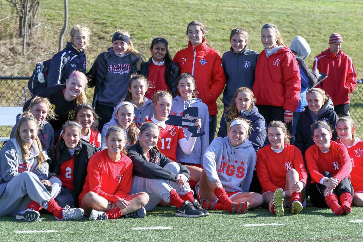 The Niskayuna girls' soccer team poses with its consolation plaque after falling to Massapequa 3-1 in the state semifinals at Tompkins-Cortland Community College on Saturday, Nov. 12, 2016. (Robert Dungan / Special to the Times Union)