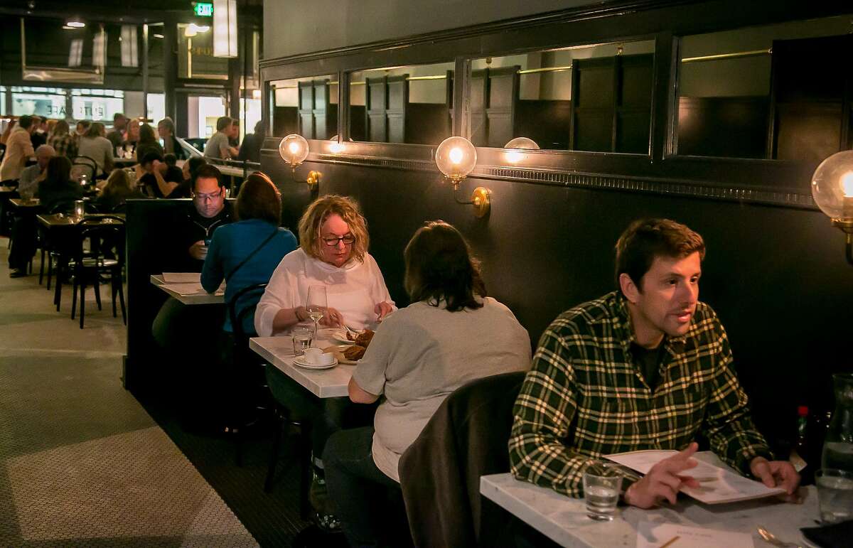 People have dinner at the Elite Cafe in San Francisco in 2016