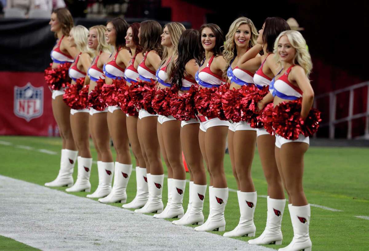 cheerleaders perform at a half time during the second half of an NFL footba...