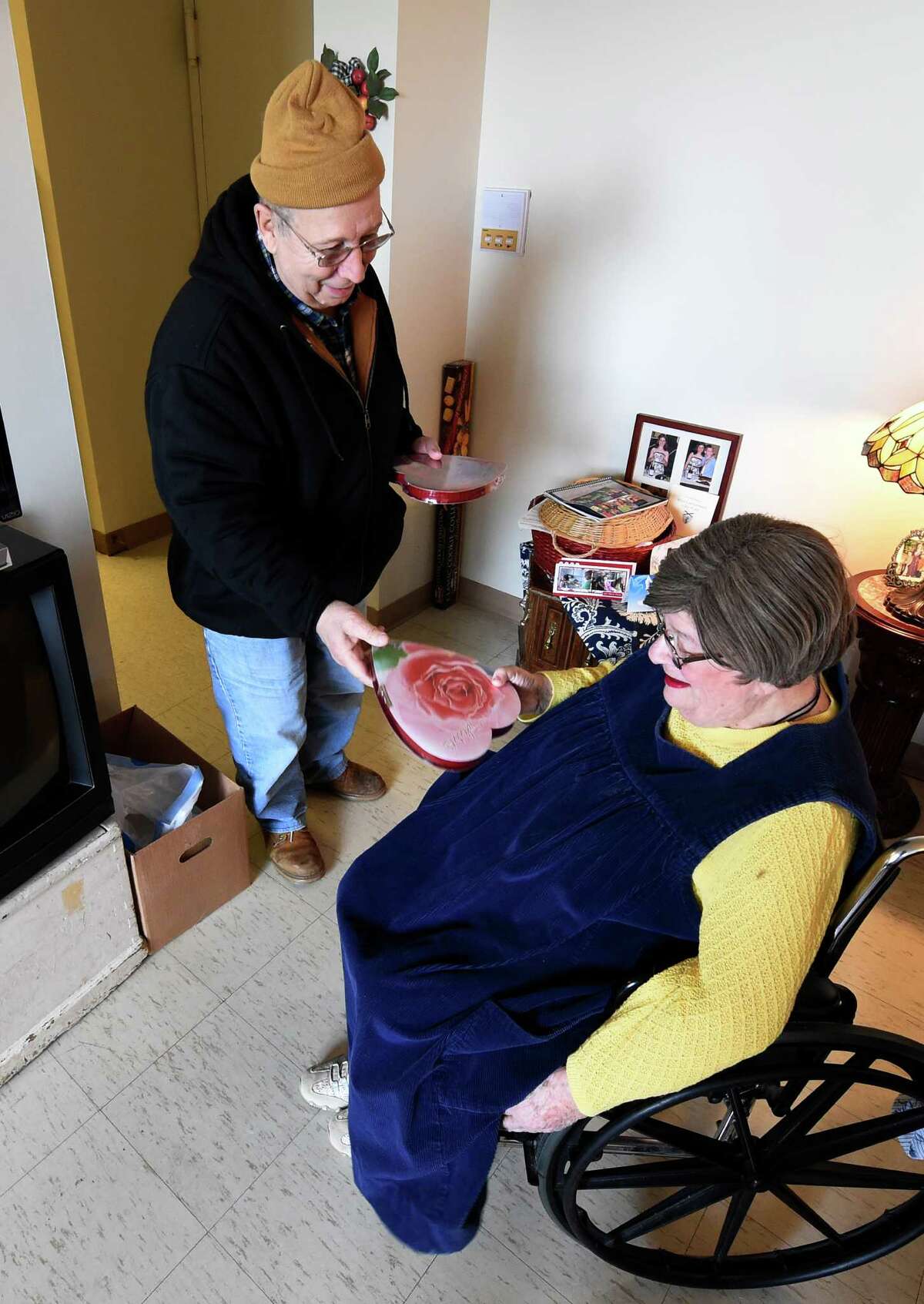 Meals on Wheels driver Joe Marcello Jr. makes a delivery to Marlene Straus at the Ohav Shalom apartments Friday Feb. 12, 2016 in Albany, N.Y. (Skip Dickstein/Times Union)