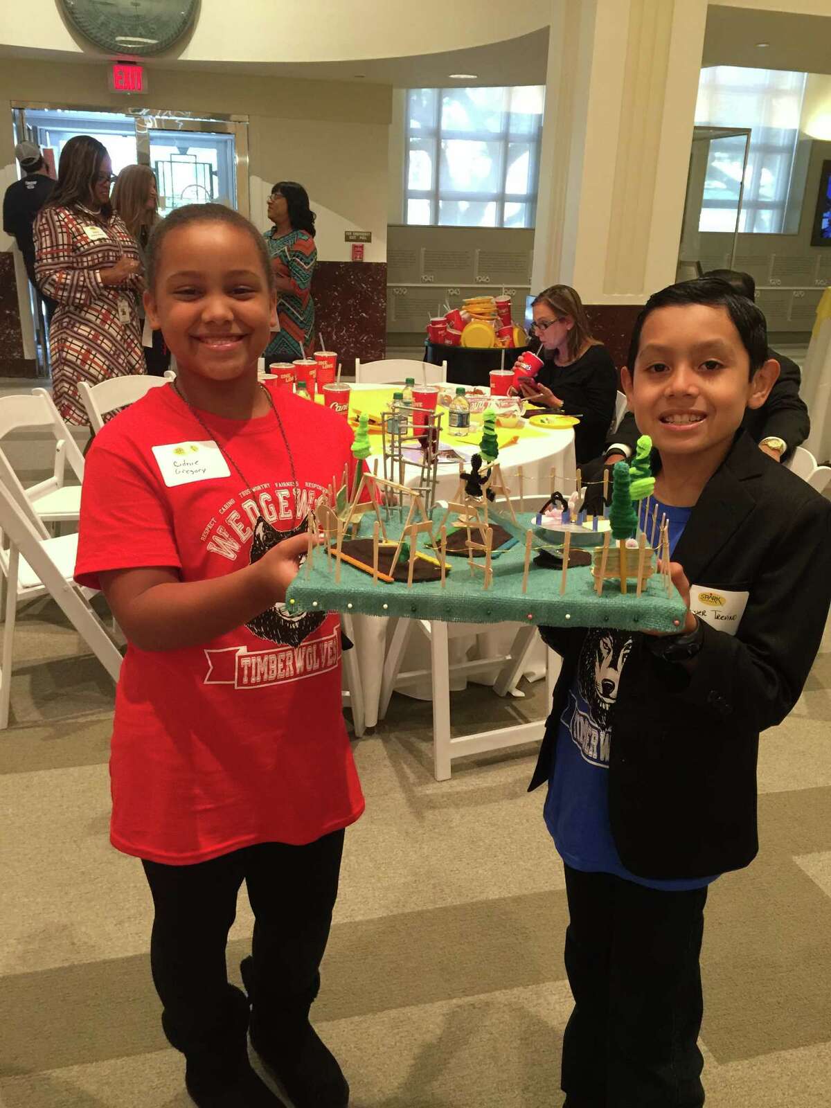 Wedgewood Elementary School fifth-grade pupil Cidnie Gregory and fourth-grade pupil Conner Trevino present a model of the planned SPARK Park to be developed at the campus.