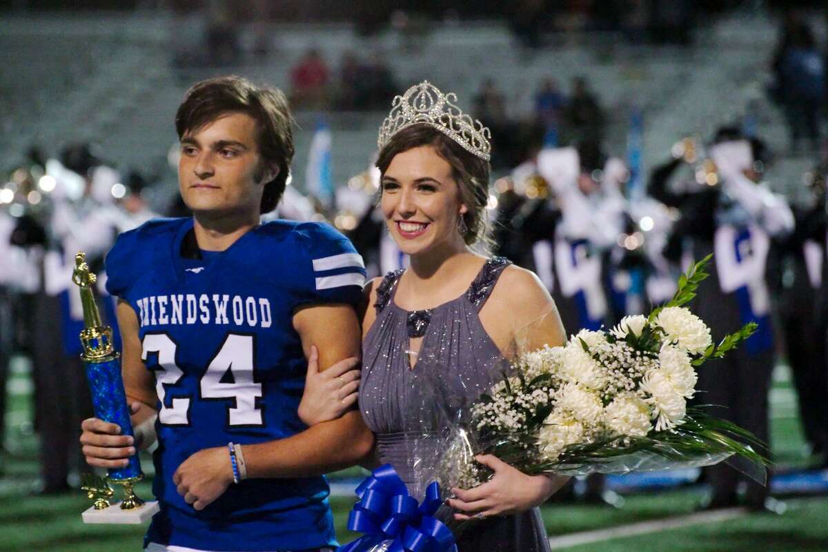 Elaina Roher escorted by Friendswood's Cody Williamson is crowned Friendswood High School Homecoming Queen during the game against Clear Lake Friday, Oct. 21 at Friendswood High School.