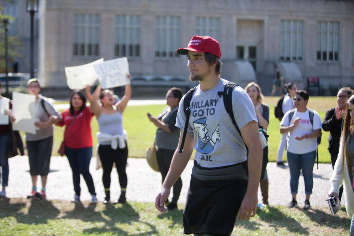 Students at the University of Houston chant as they march through campus during a planned walkout and protest Monday afternoon, Nov. 14, 2016, in Houston.