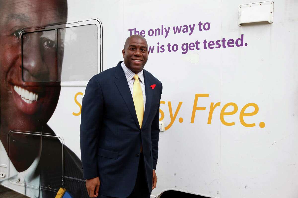 We all should thank Magic Johnson and actor Charlie Sheen for reminding the public that the fight against HIV is not over. (Associated Press File Photo)