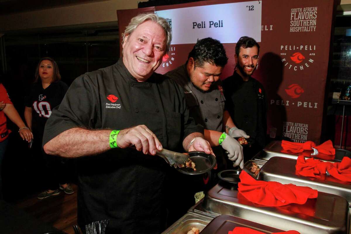 Paul Friedman, executive chef and owner of Peli Peli, serving Bacon Wrapped Shrimp at Taste of the Texans. (For the Chronicle/Gary Fountain, November 14, 2016)