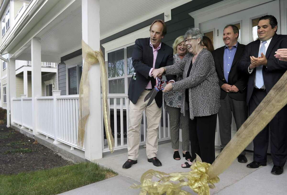 The Grand at Bethel held an official ribbon-cutting ceremony Monday, Nov. 14, 2016. From left are Bob Gleason, a partner, his wife Pam Gleason, Pat Rist, chairman of Planning and Zoning, Janis Chrzescijanek, Bethel's economic development director and Richard Harmony with Union Savings Bank and Gary Michael Jr., son of a partner.
