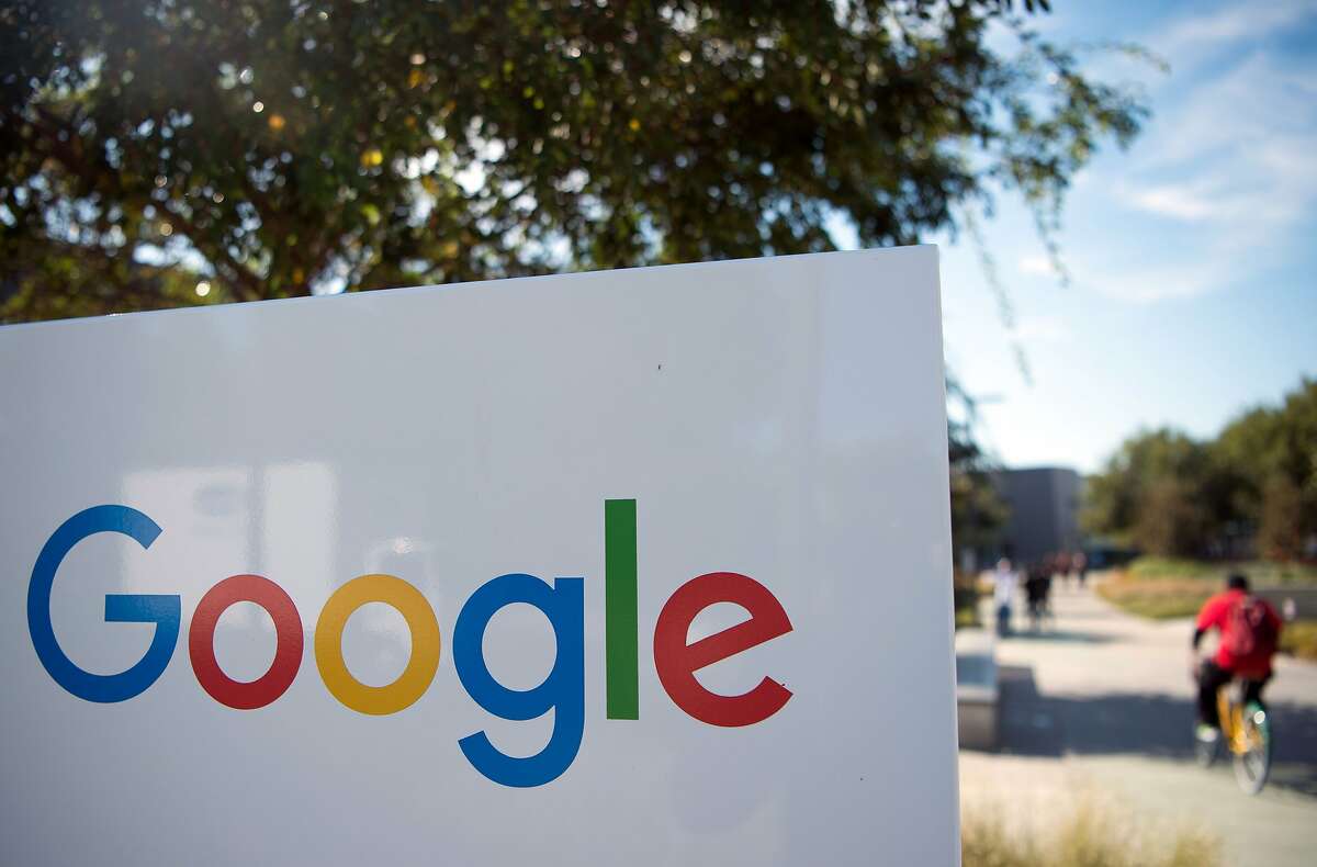 (FILES) This file photo taken on November 4, 2016 shows a man riding a bike past a Google sign at the Googleplex in Menlo Park, California. Google and Facebook moved November 15, 2016 to cut off advertising revenue to bogus news sites, acting after criticism of the role fake news played in the US presidential election. "We've been working on an update to our publisher policies and will start prohibiting Google ads from being placed on misrepresentative content, just as we disallow misrepresentation in our ads policies," a Google statement to AFP said. / AFP PHOTO / JOSH EDELSONJOSH EDELSON/AFP/Getty Images