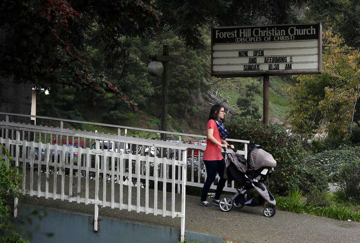 A woman walks past the Forest Hill Christian Church on Laguna Honda Boulevard in San Francisco, Calif. on Tuesday, Nov. 15, 2016. Residents are unhappy with a proposed plan to build 150 units of affordable senior housing on the site.