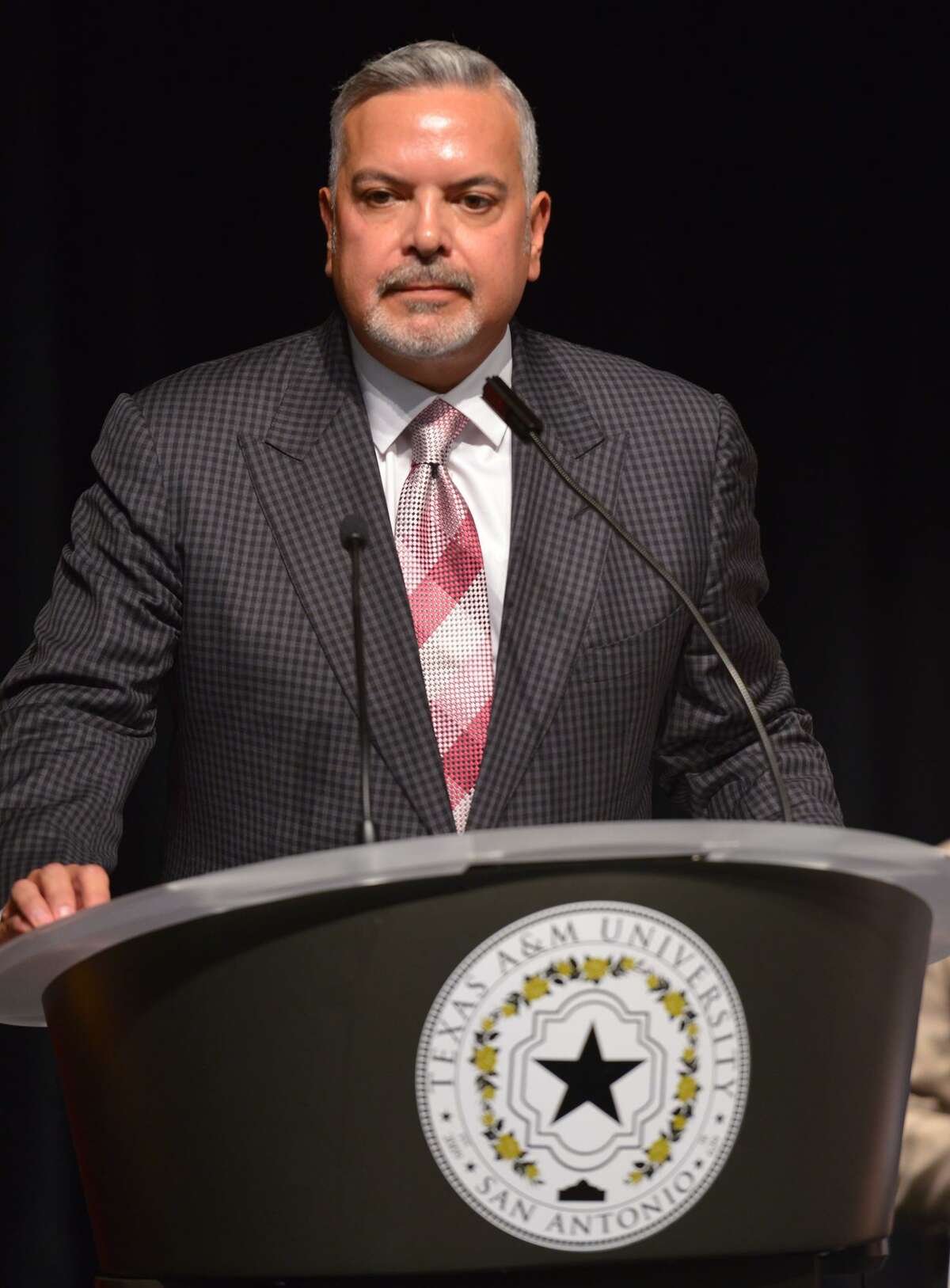 Henry Munoz, Chairman of the Board and CCO, Munoz & Company, speaks during the debut ceremonies for the new Central Academc Building at Texas A&M San Antonio Wednesday morning.