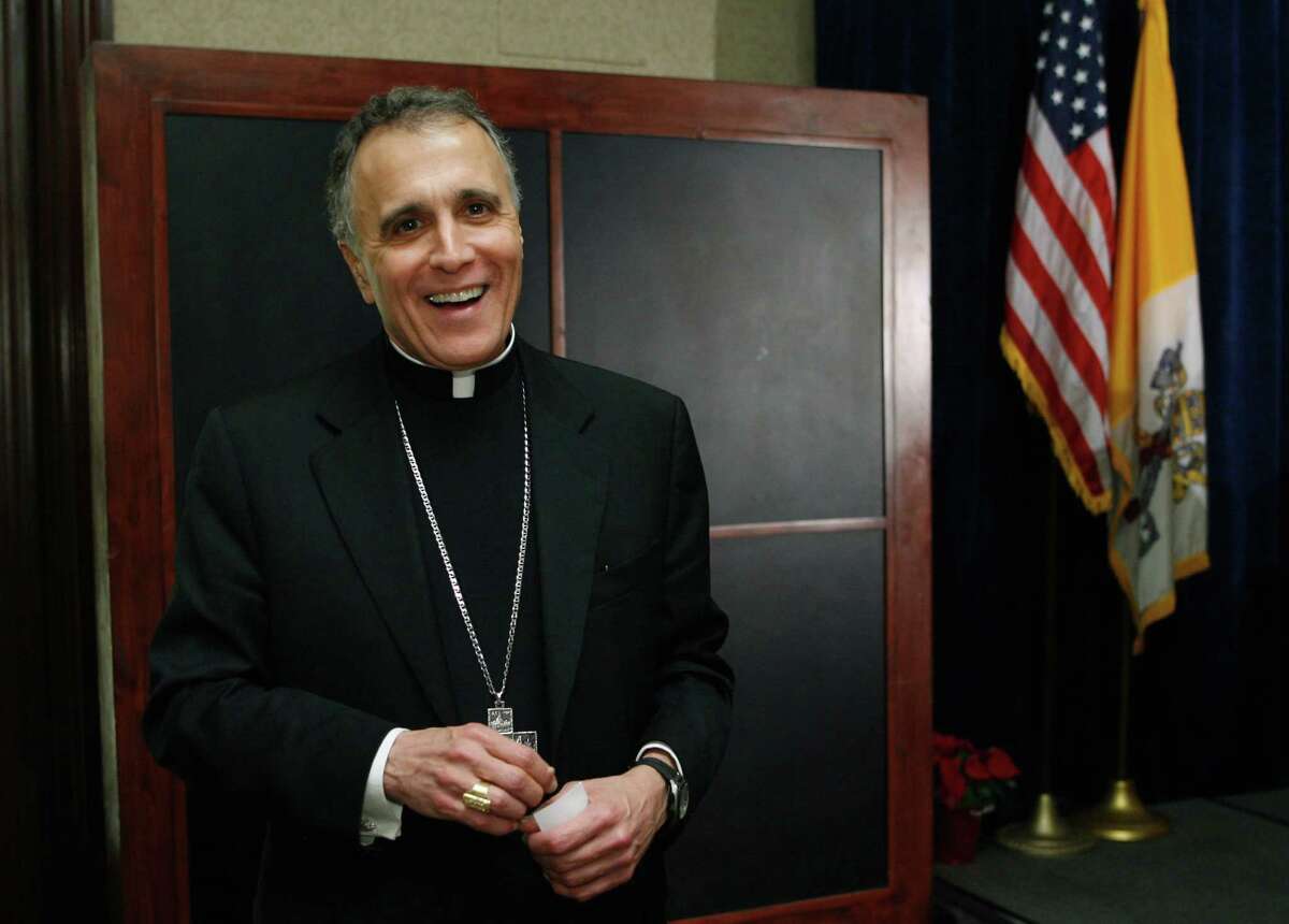 Cardinal Daniel N. DiNardo is shown before a luncheon in his honor hosted by Gov. Rick Perry Wednesday, Dec. 12, 2007, in Austin, Texas. The luncheon honors Cardinal DiNardo, marking the first time a Roman Catholic archbishop located in Texas has been elevated to the College of Cardinals. (AP Photo/Harry Cabluck)