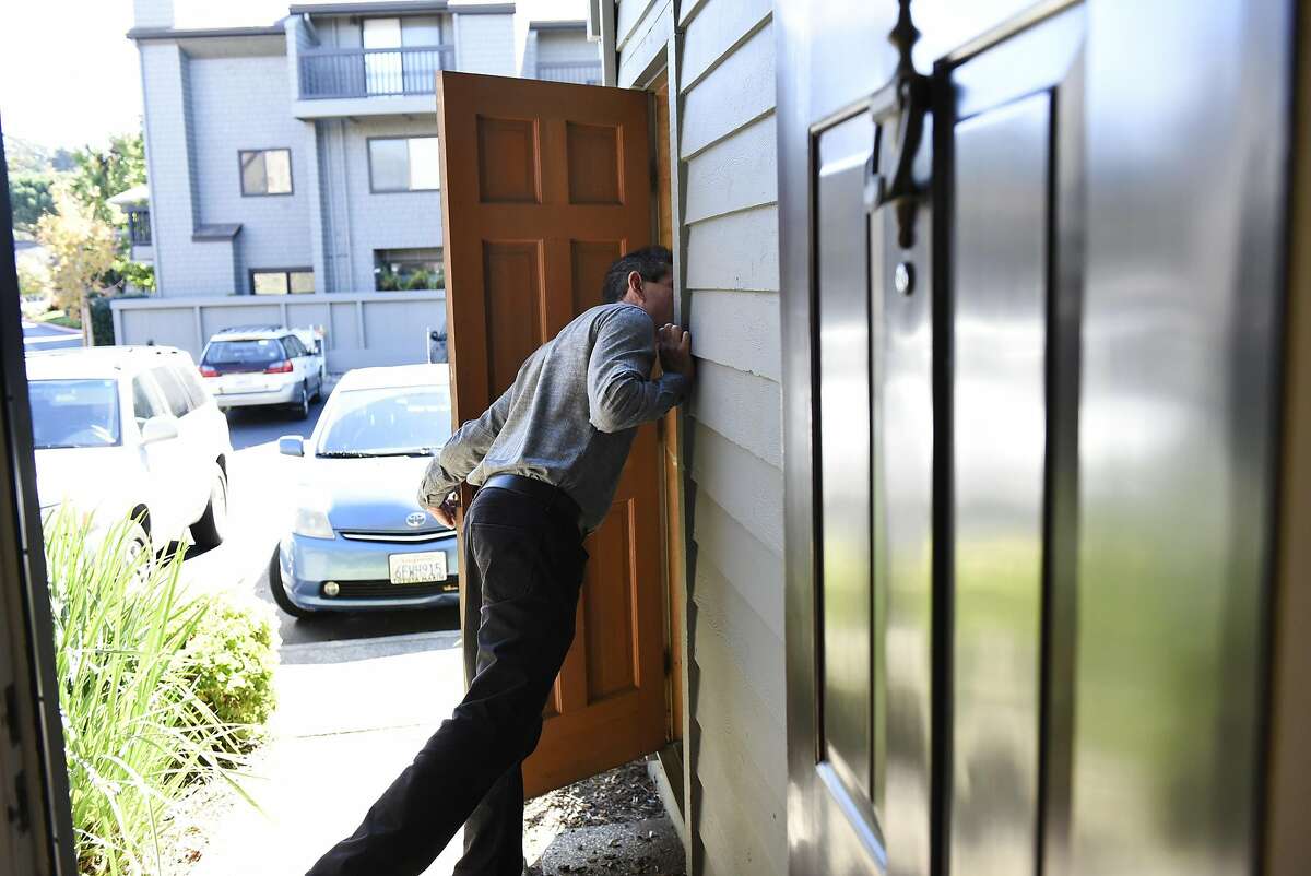 Broker Steve Sekhon of McGuire Real Estate peeks into a storage space during a broker's open house for a condo hosted by Joan Kermath of Sotheby's International Reality, in Sausalito, CA Wednesday, November 16, 2016.