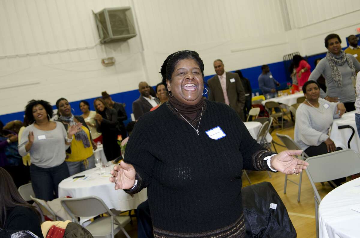Brenda Penn Williams, of Norwalk, joyfully participates in a cheer during the 75th anniversary alumni reunion at the Carver Center in Norwalk in February 2013. Penn-Williams was elected president of the Norwalk NAACP on Tuesday.